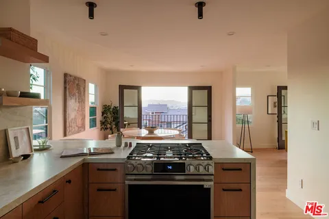 a kitchen with a stove and a sink