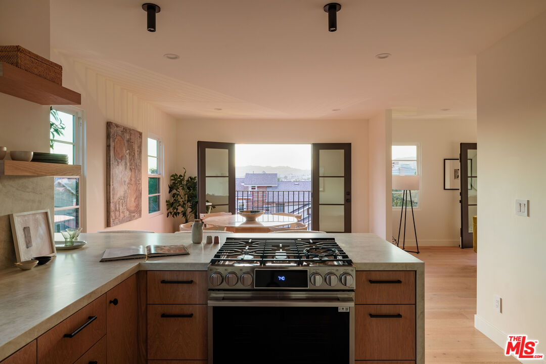 1016 Manzanita Street Los Angeles, CA 90029 - Photo 10 of 35 a kitchen with a stove and a sink