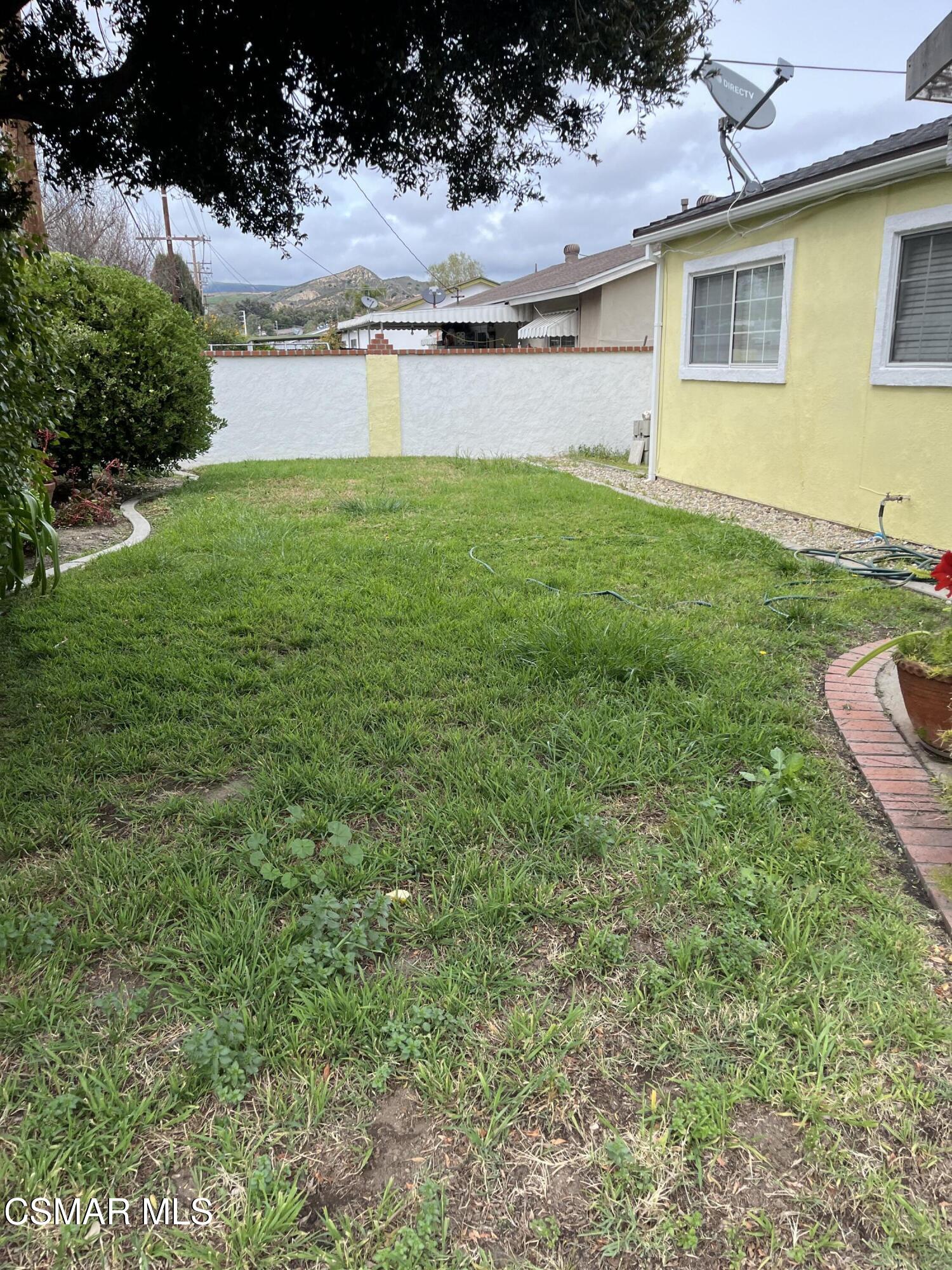 2161 Lysander Avenue Simi Valley, CA 93065 - Photo 33 of 44 a view of a house with a yard and a large tree