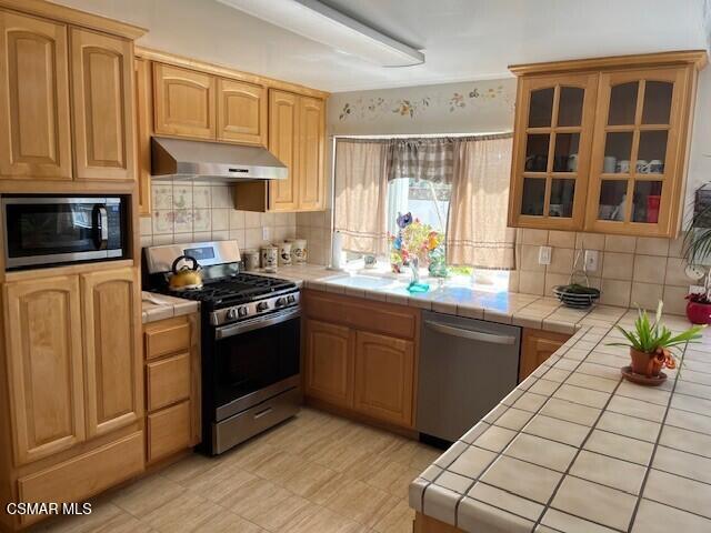 2161 Lysander Avenue Simi Valley, CA 93065 - Photo 7 of 44 a kitchen with stainless steel appliances granite countertop a stove a sink and a microwave