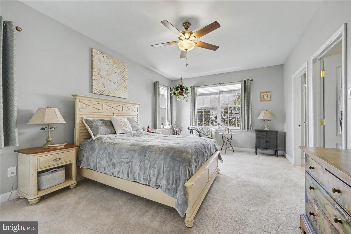 32 Par Circle Pottstown, PA 19464 - Photo 15 of 34 a bedroom with a bed and a chandelier