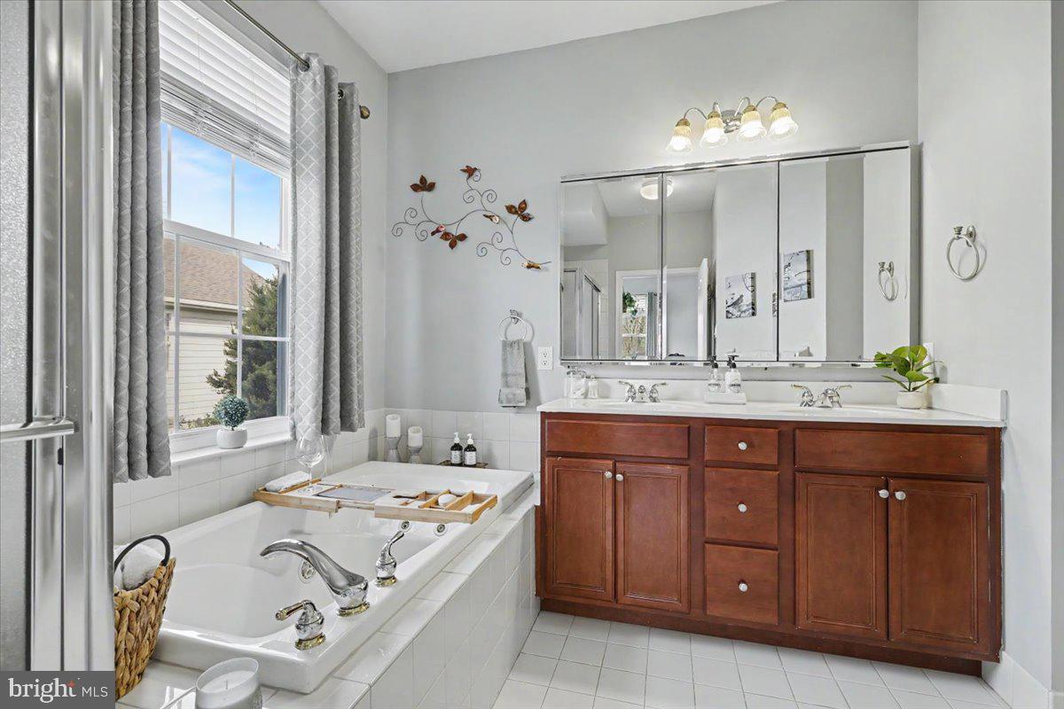 32 Par Circle Pottstown, PA 19464 - Photo 17 of 34 a spacious bathroom with a granite countertop tub sink and mirror
