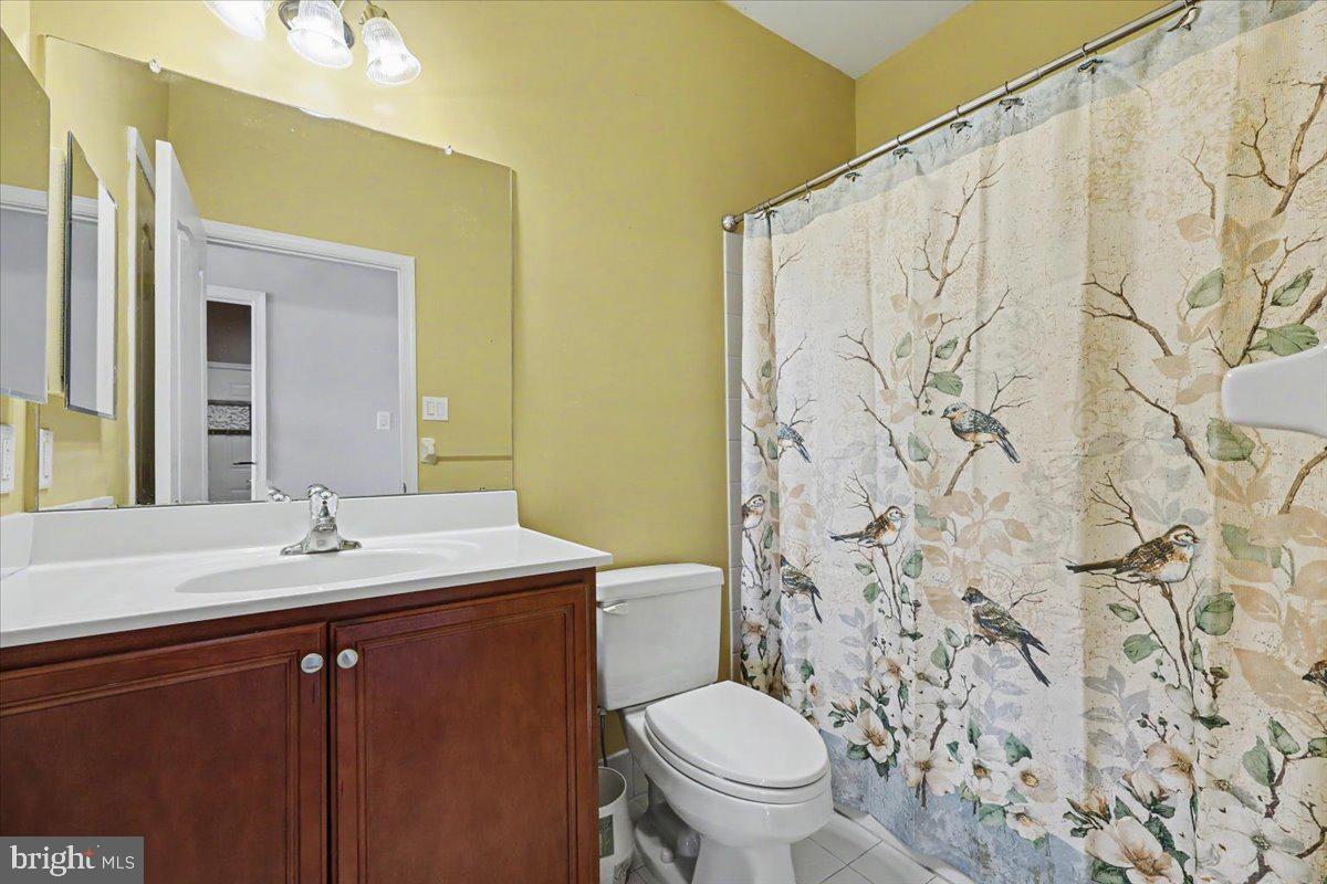 32 Par Circle Pottstown, PA 19464 - Photo 21 of 34 a bathroom with a granite countertop sink and a mirror
