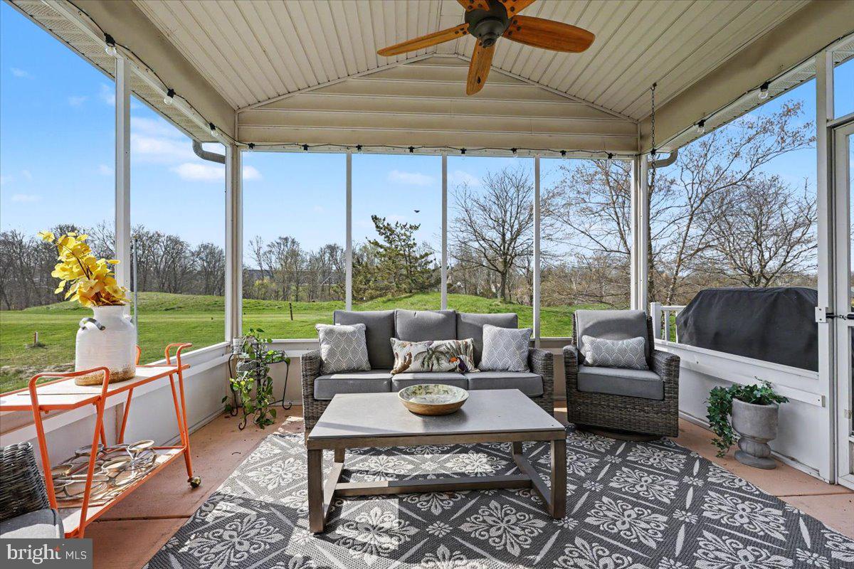 32 Par Circle Pottstown, PA 19464 - Photo 27 of 34 a living room with patio furniture and a floor to ceiling window