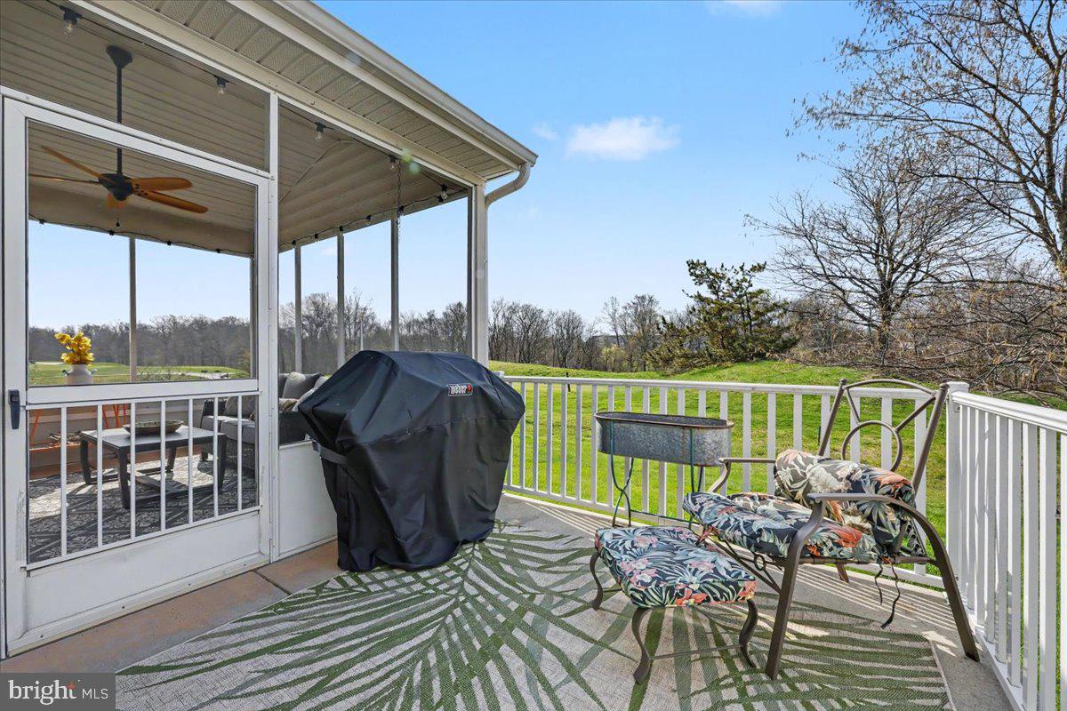 32 Par Circle Pottstown, PA 19464 - Photo 28 of 34 a view of a deck with chair and wooden floor