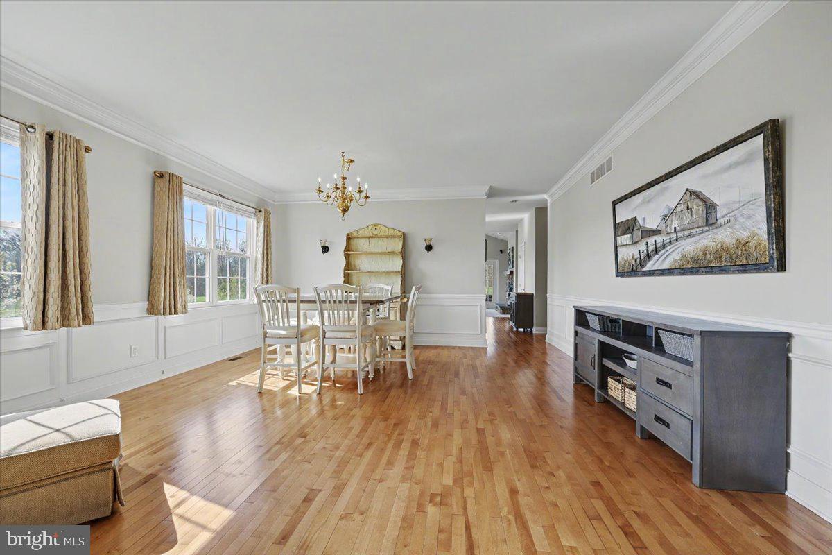 32 Par Circle Pottstown, PA 19464 - Photo 4 of 34 a living room with furniture and a dining table with wooden floor