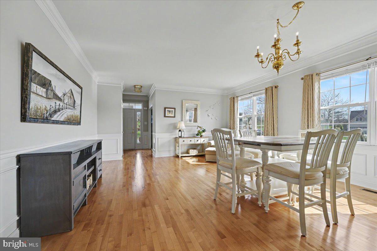 32 Par Circle Pottstown, PA 19464 - Photo 6 of 34 a view of a dining room with furniture a chandelier and wooden floor