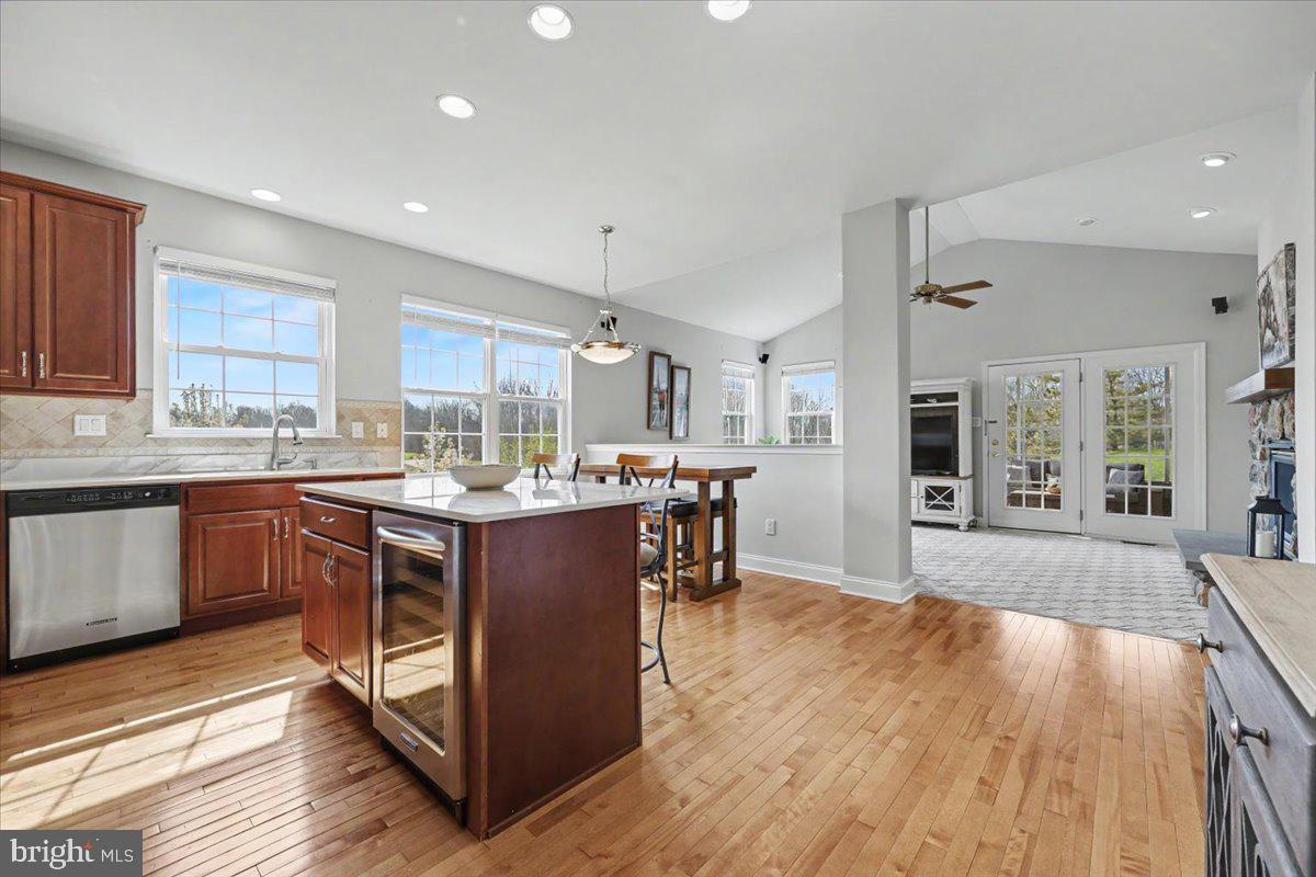 32 Par Circle Pottstown, PA 19464 - Photo 7 of 34 a kitchen with kitchen island granite countertop wooden floors and a sink