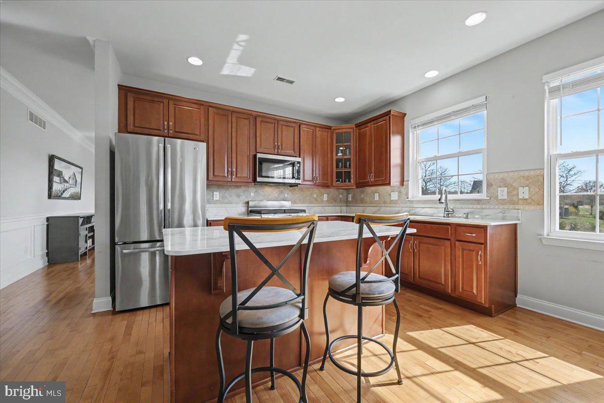 32 Par Circle Pottstown, PA 19464 - Photo 10 of 34 a kitchen with granite countertop wooden cabinets and stainless steel appliances
