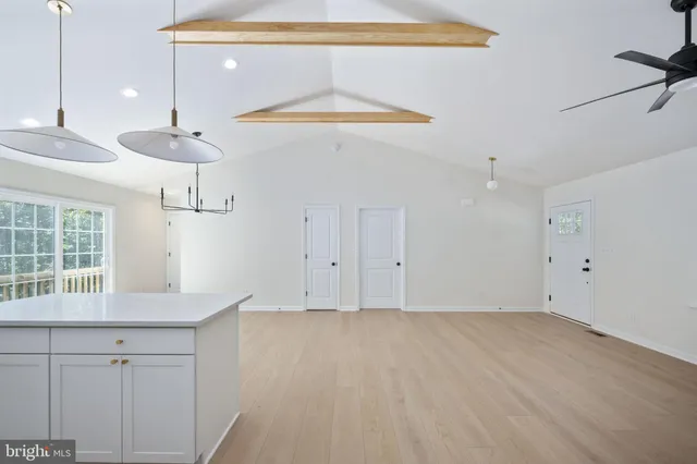 a kitchen with a sink stove and refrigerator