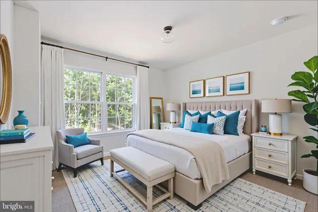 a bathroom with a bathtub shower sink vanity and toilet