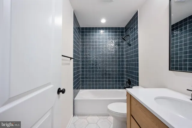 a bedroom with a bed and lamp