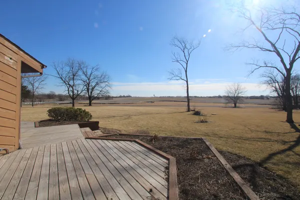 a view of a backyard with wooden floor