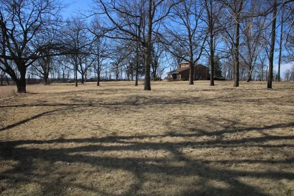 a view of outdoor space with lots of trees