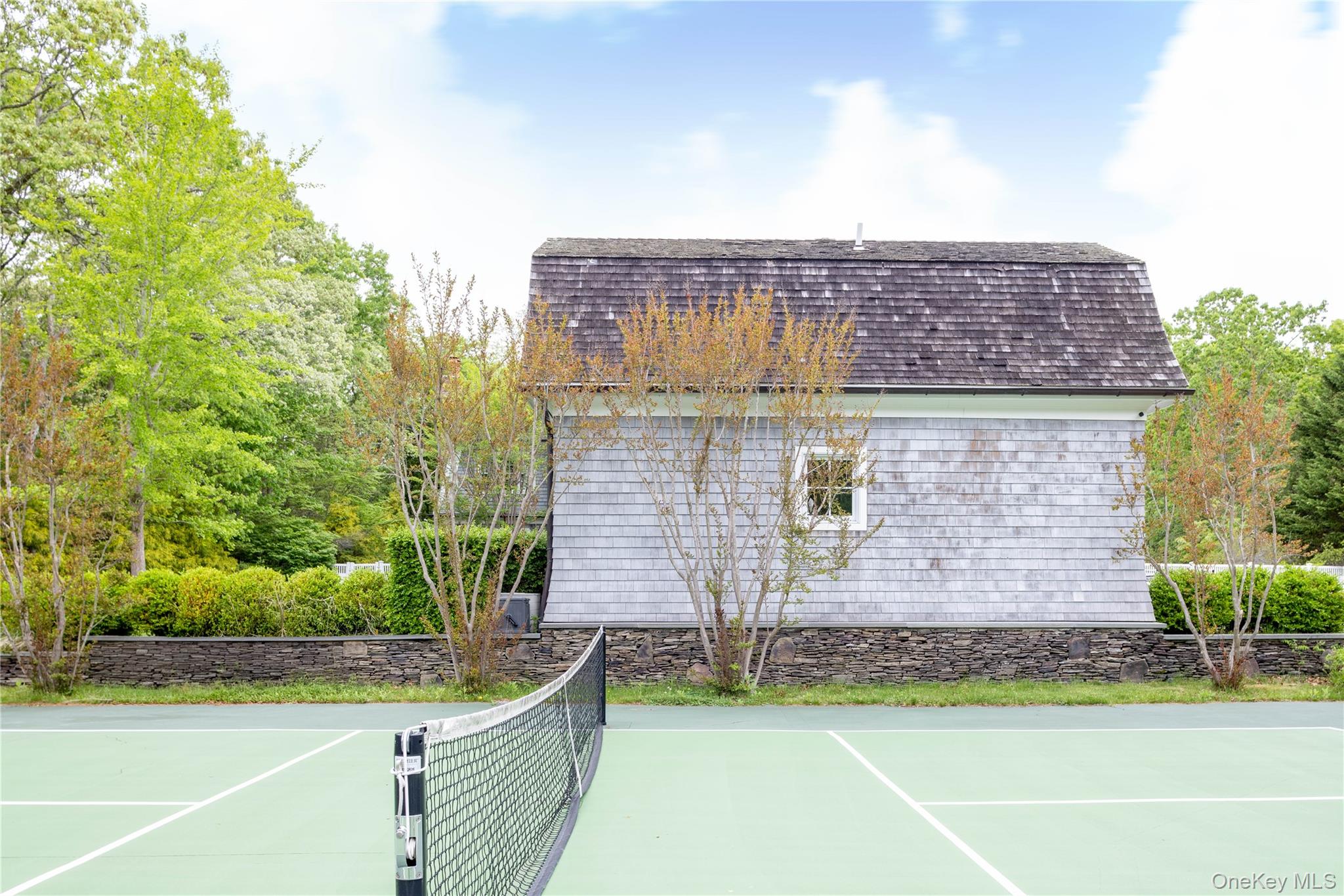486 Middle Line Highway Bridgehampton, NY 11976 - Photo 22 of 25 a front view of a house with a yard