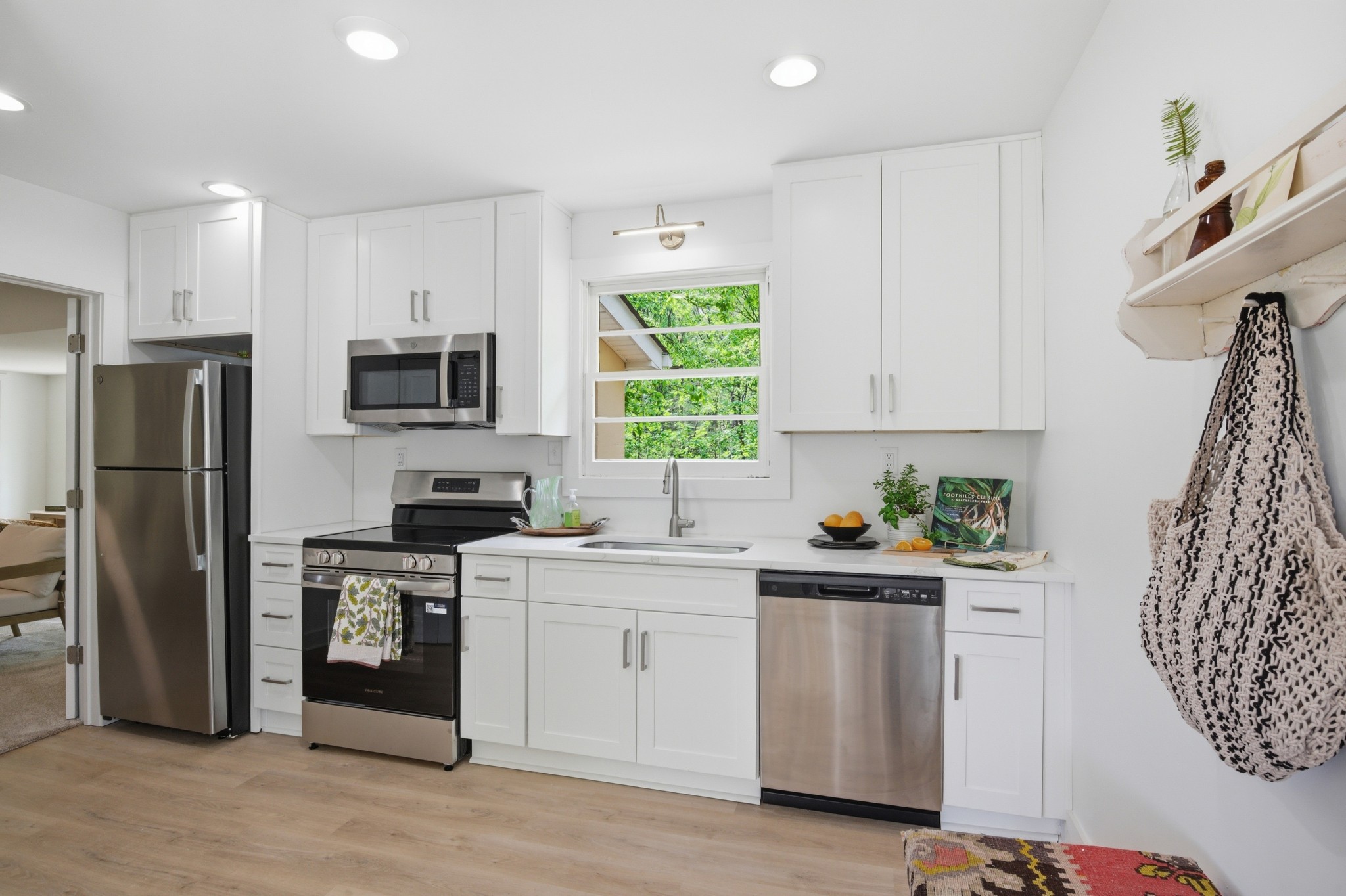1566 Porter Road Burns, TN 37029 - Photo 11 of 41 a kitchen with stainless steel appliances granite countertop a refrigerator sink and stove