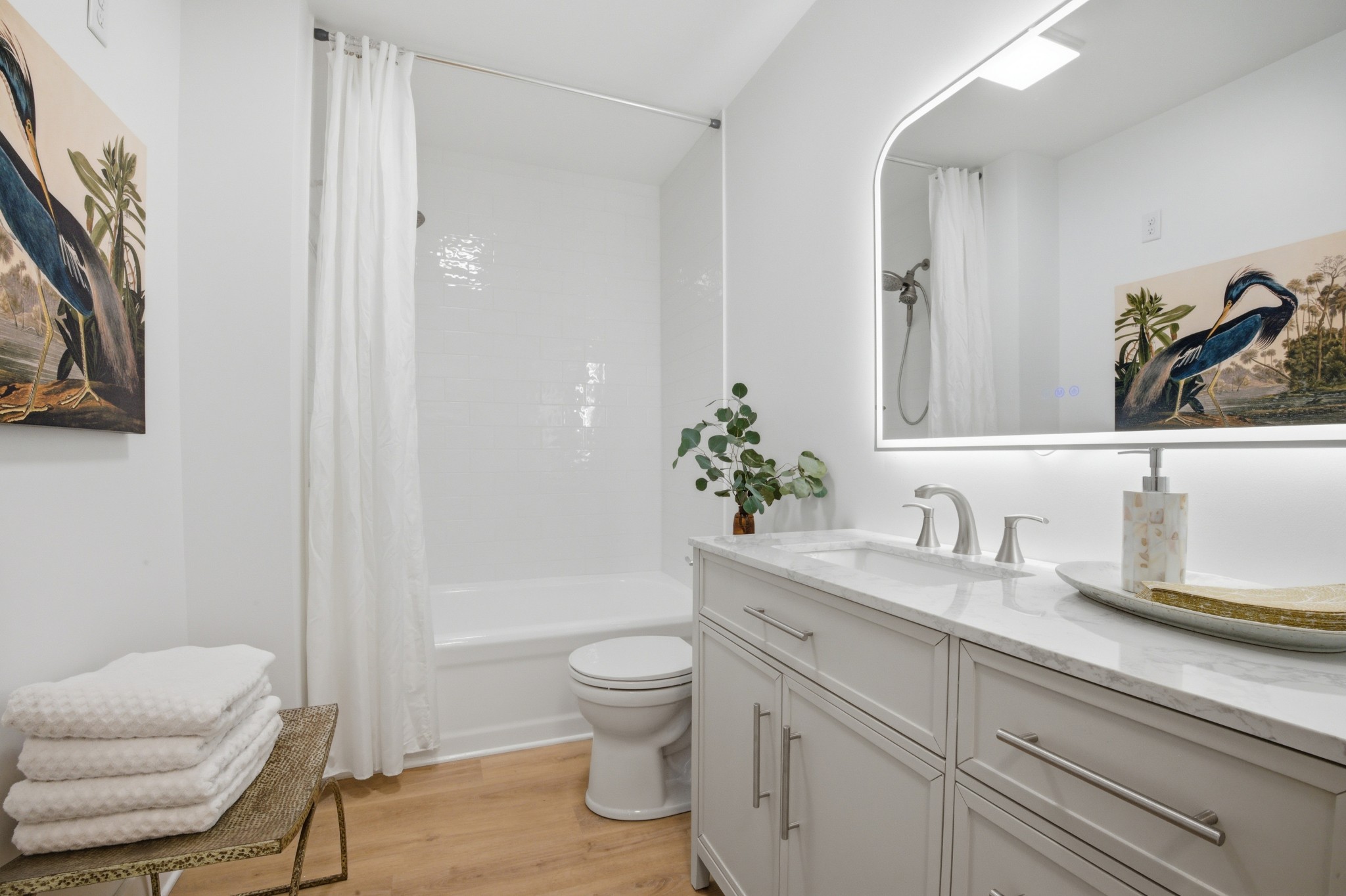 1566 Porter Road Burns, TN 37029 - Photo 22 of 41 a bathroom with a granite countertop toilet sink and mirror