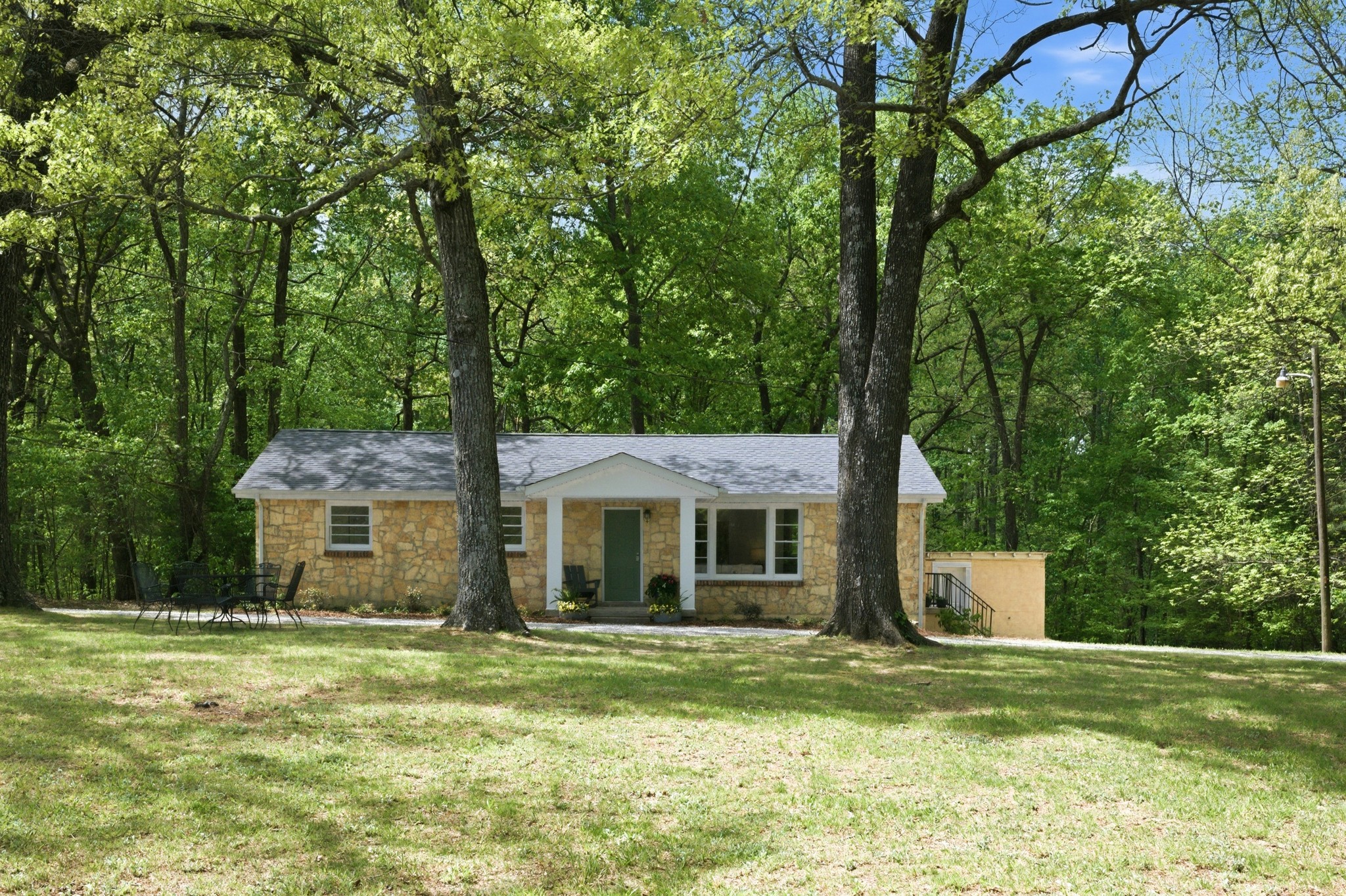1566 Porter Road Burns, TN 37029 - Photo 39 of 41 a front view of a house with a yard and trees