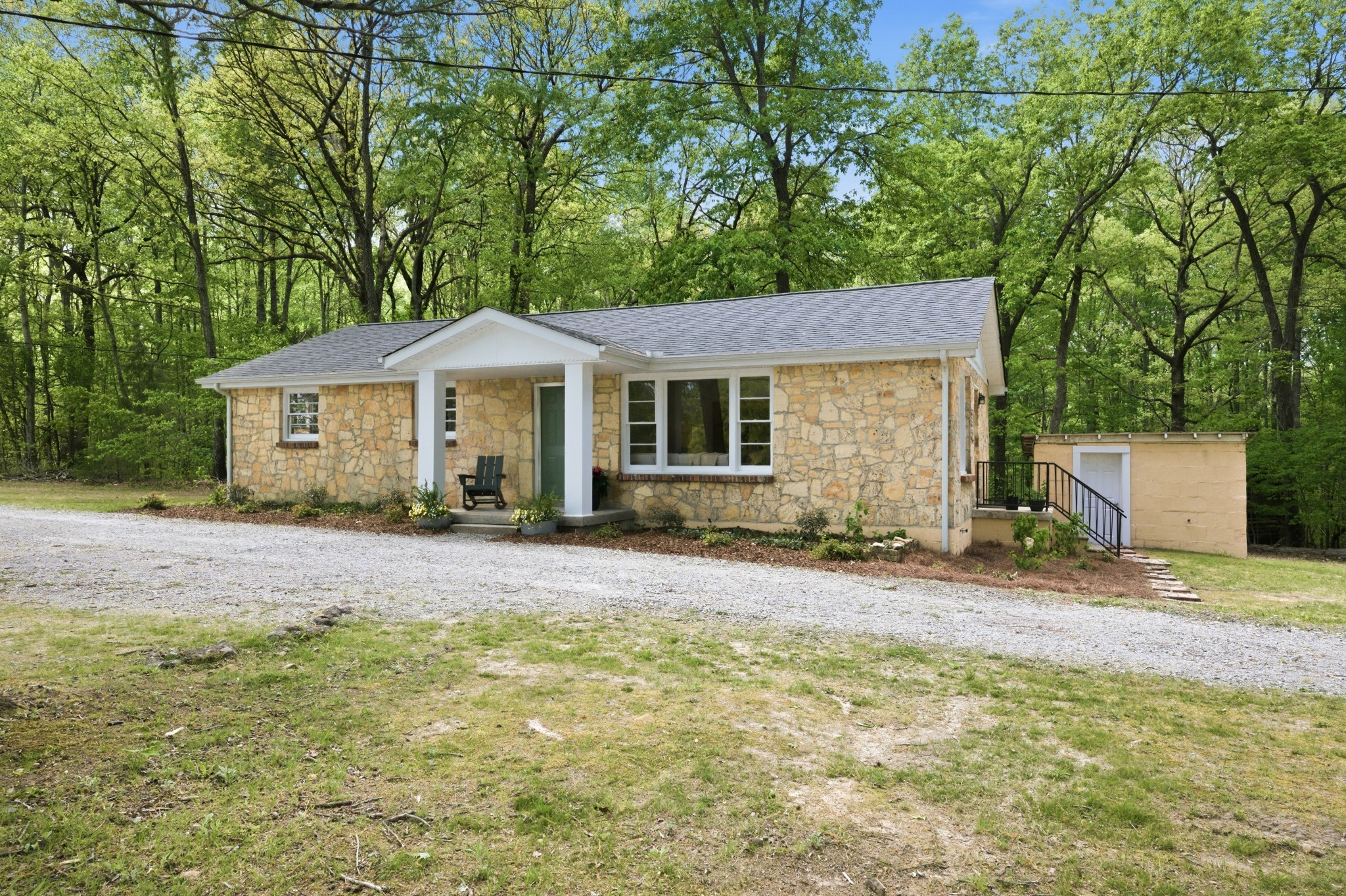 1566 Porter Road Burns, TN 37029 - Photo 41 of 41 a view of a house with a yard and large tree