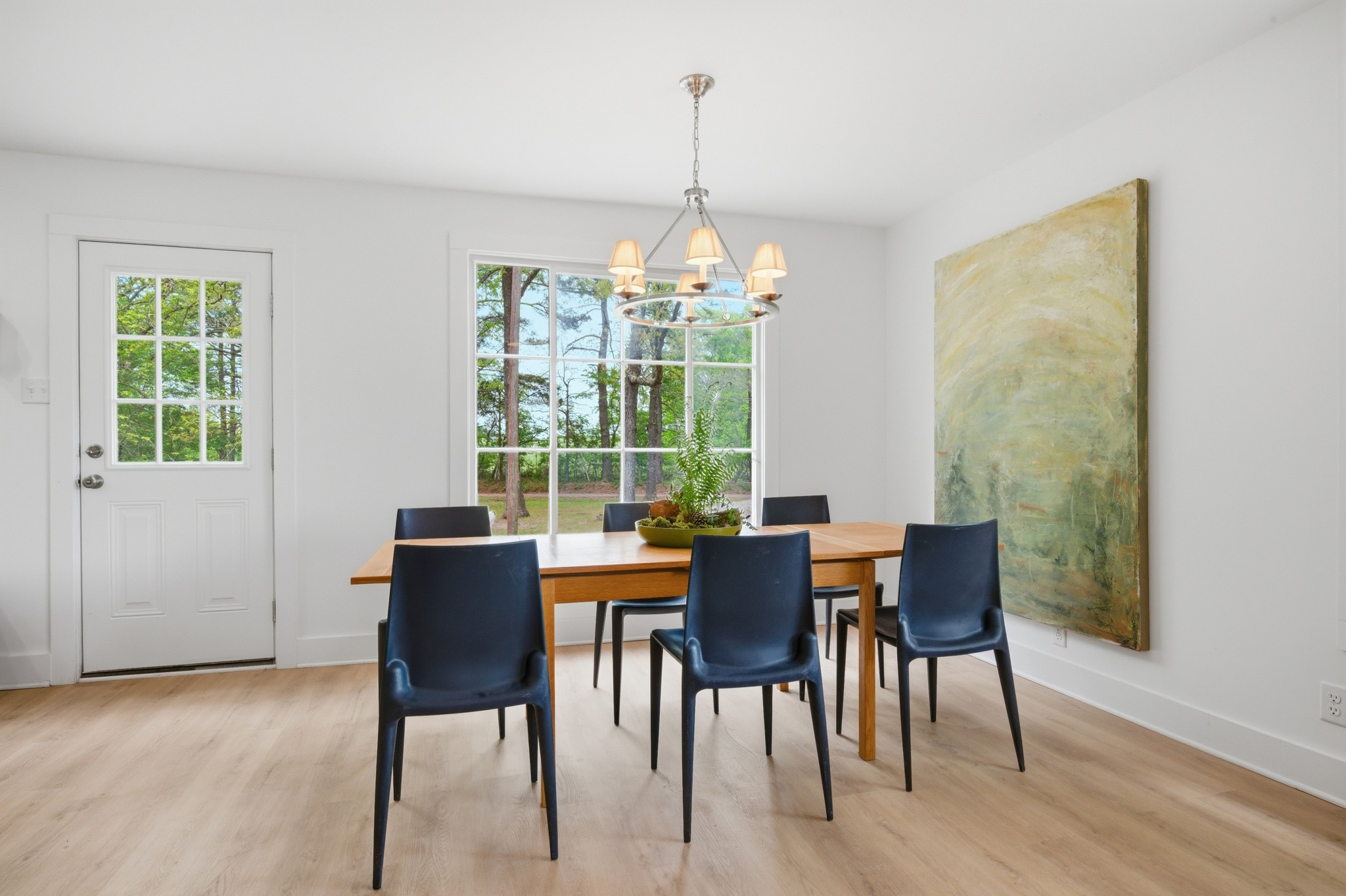 1566 Porter Road Burns, TN 37029 - Photo 7 of 41 a dining room with furniture a chandelier and wooden floor