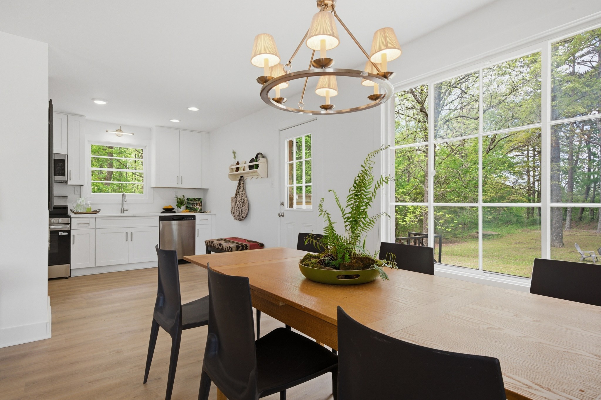 1566 Porter Road Burns, TN 37029 - Photo 9 of 41 a view of a dining room with furniture a chandelier and wooden floor