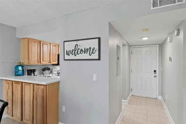 a kitchen with stainless steel appliances a refrigerator and a sink