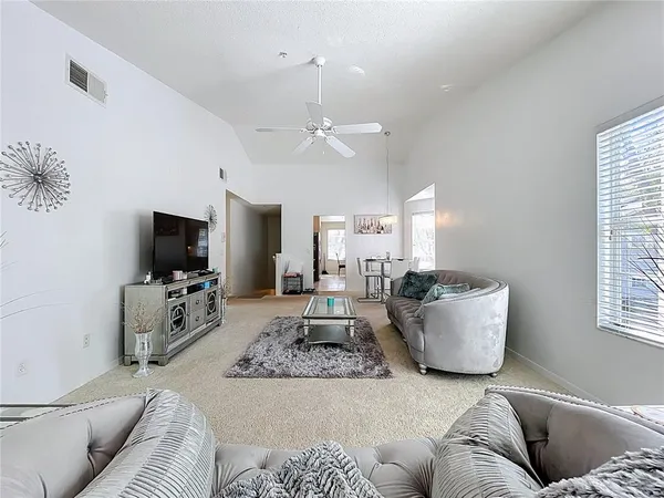 a living room with furniture and a large window