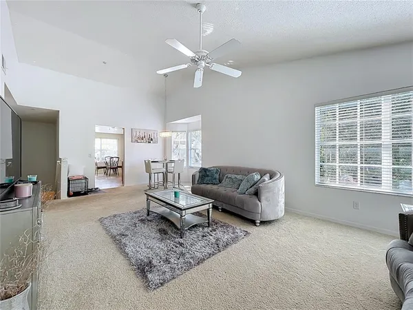 a kitchen with granite countertop cabinets stainless steel appliances a sink and a window