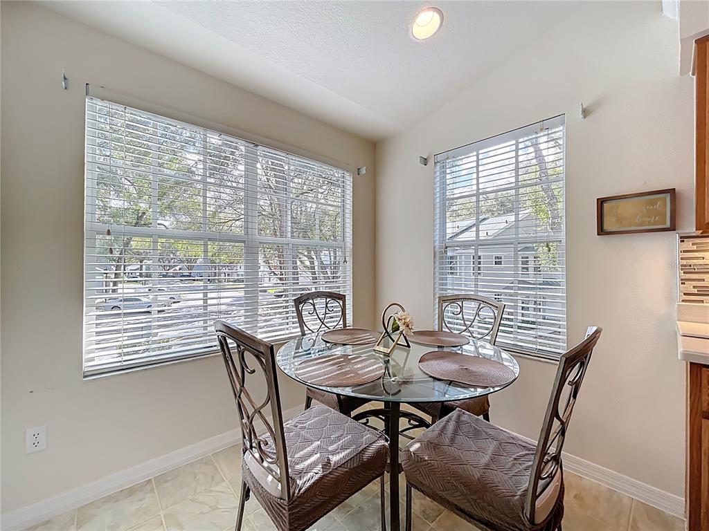 1050 Loch Vail, Unit 21 Apopka, FL 32712 - Photo 19 of 46 a view of a dining room with furniture window and outside view