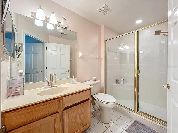 a bathroom with a sink vanity and a mirror