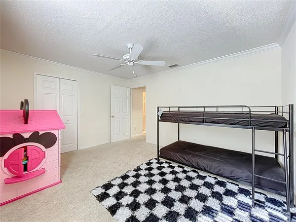 a bedroom with a bed and a walk in closet