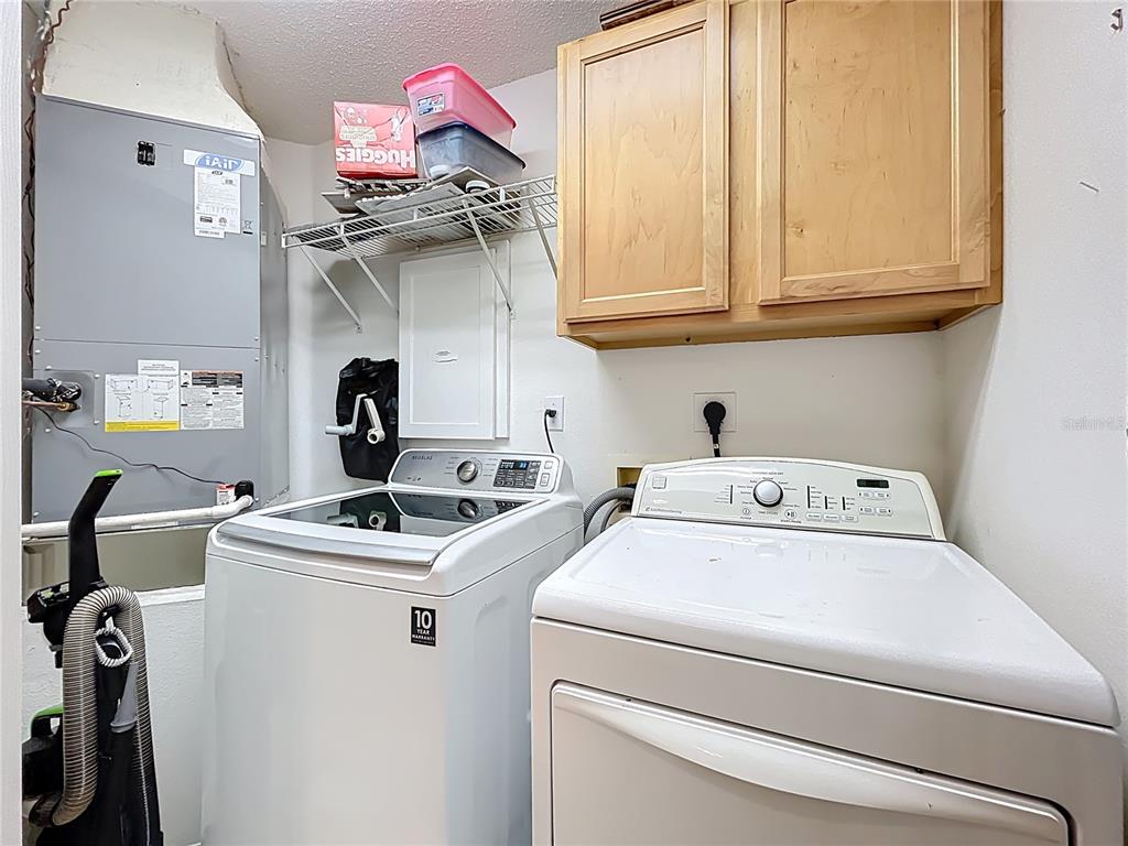 1050 Loch Vail, Unit 21 Apopka, FL 32712 - Photo 39 of 46 a utility room with dryer and washer