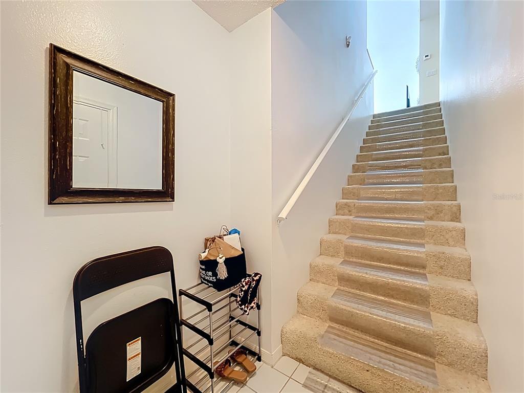 1050 Loch Vail, Unit 21 Apopka, FL 32712 - Photo 5 of 46 a view of entryway with wooden floor