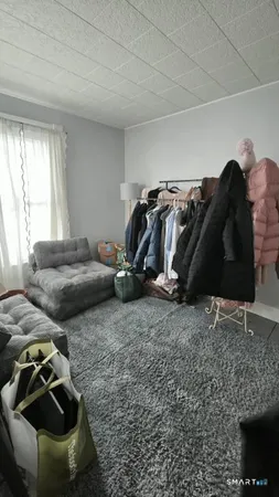 a view of a livingroom with furniture and a garage