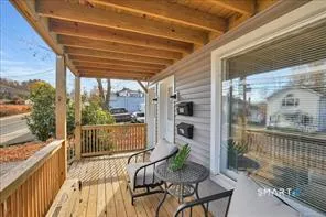a view of a balcony with furniture