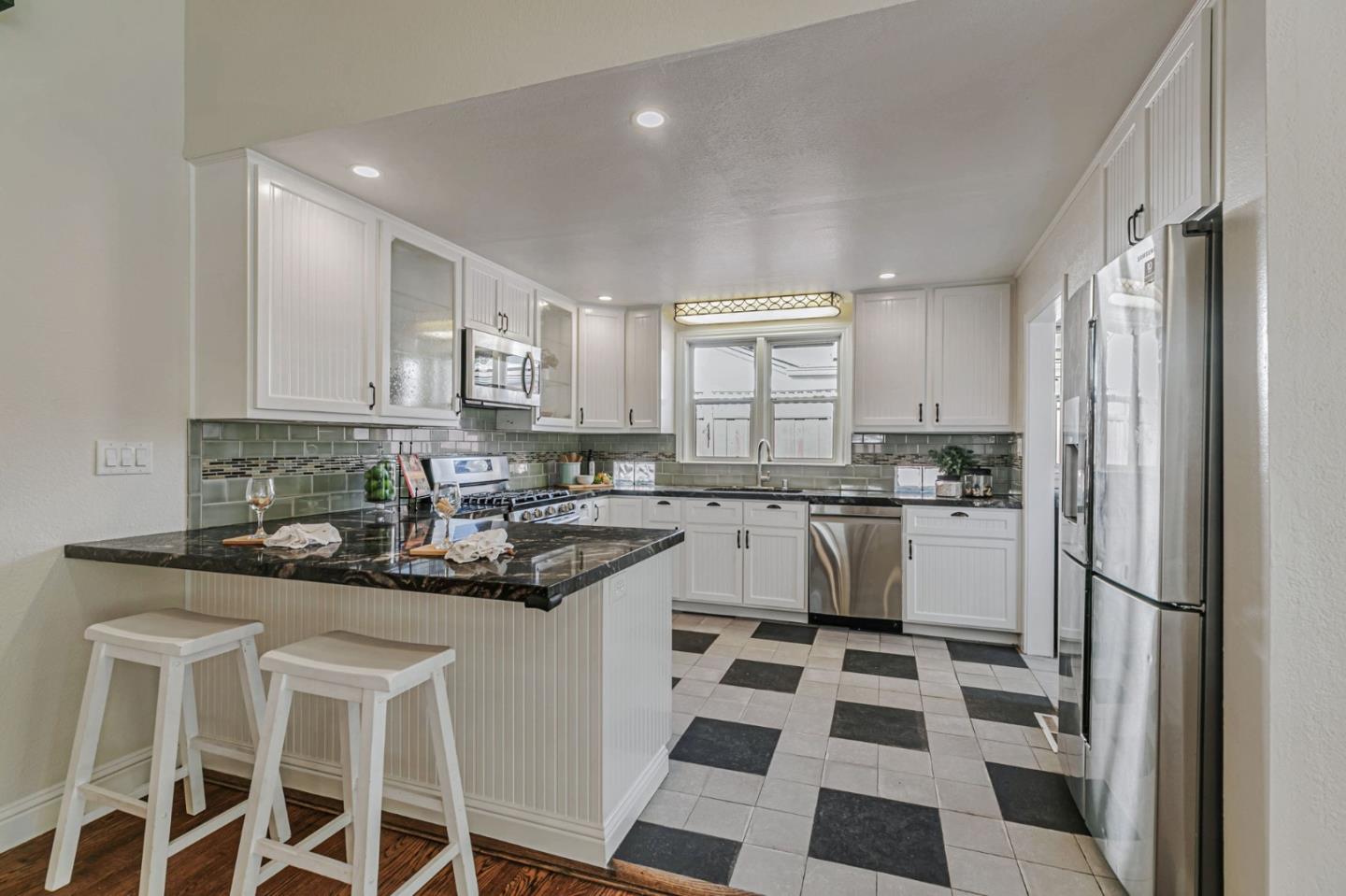 668 Curtner Avenue Campbell, CA 95008 - Photo 13 of 49 a kitchen with granite countertop stainless steel appliances a sink and cabinets