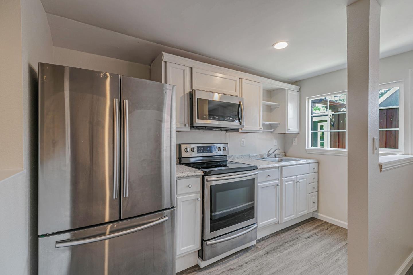 668 Curtner Avenue Campbell, CA 95008 - Photo 17 of 49 a kitchen with stainless steel appliances a refrigerator sink and microwave