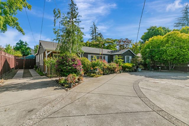 a house view with a garden space