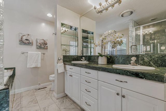 a bath tub sitting in a bathroom next to a window
