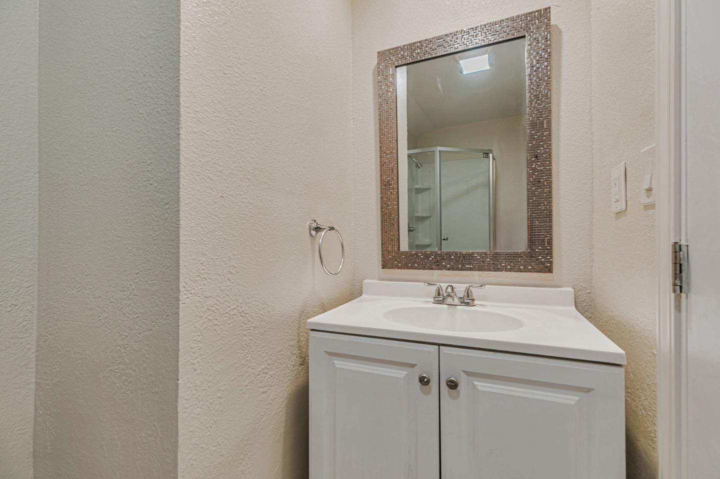 668 Curtner Avenue Campbell, CA 95008 - Photo 35 of 49 a bathroom with a sink and a mirror
