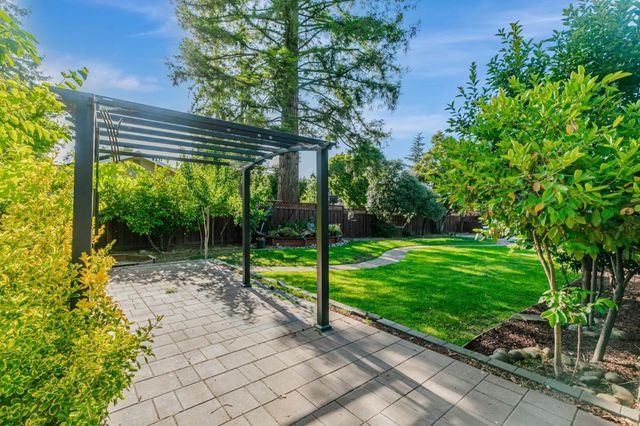 a view of a backyard with a sitting area