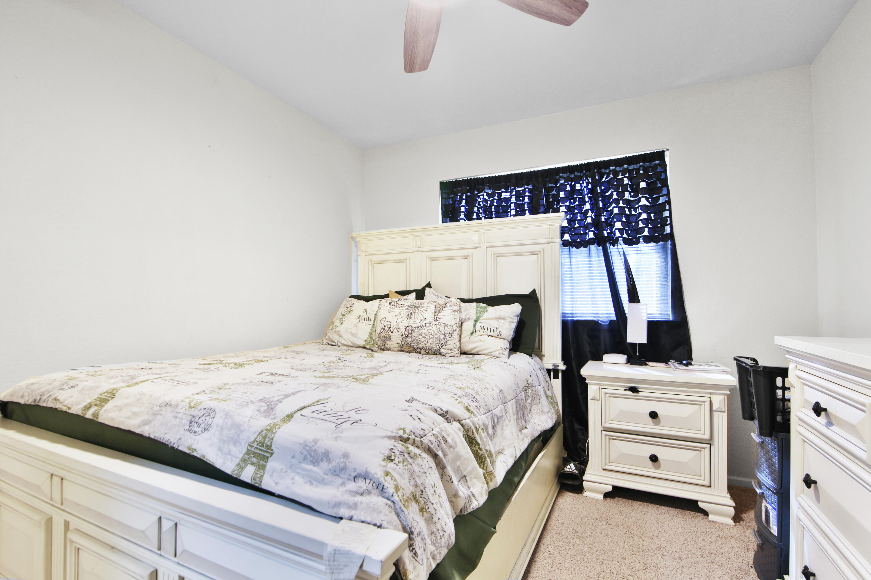 5625 Amherst Street Lubbock, TX 79416 - Photo 15 of 32 a bedroom with a bed and a window