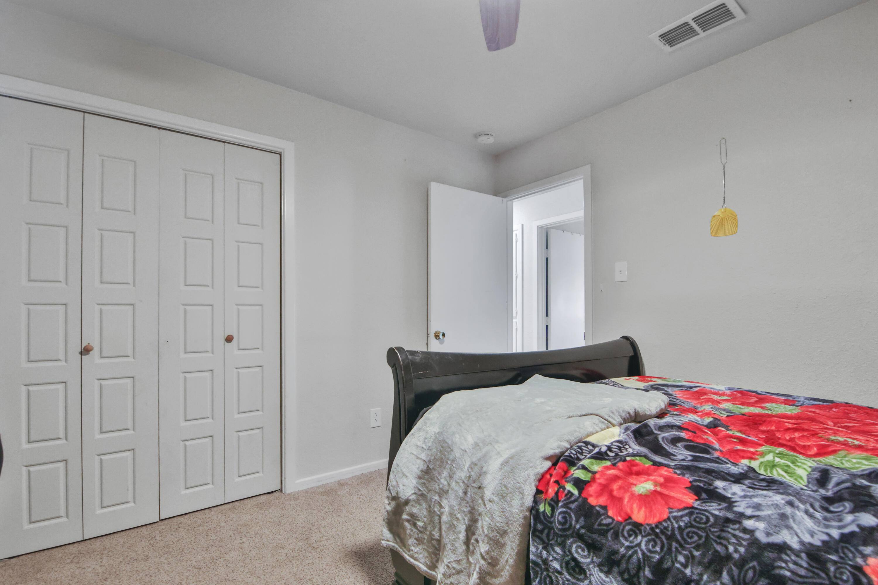 5625 Amherst Street Lubbock, TX 79416 - Photo 25 of 32 a bedroom with a bed and a painting on the wall