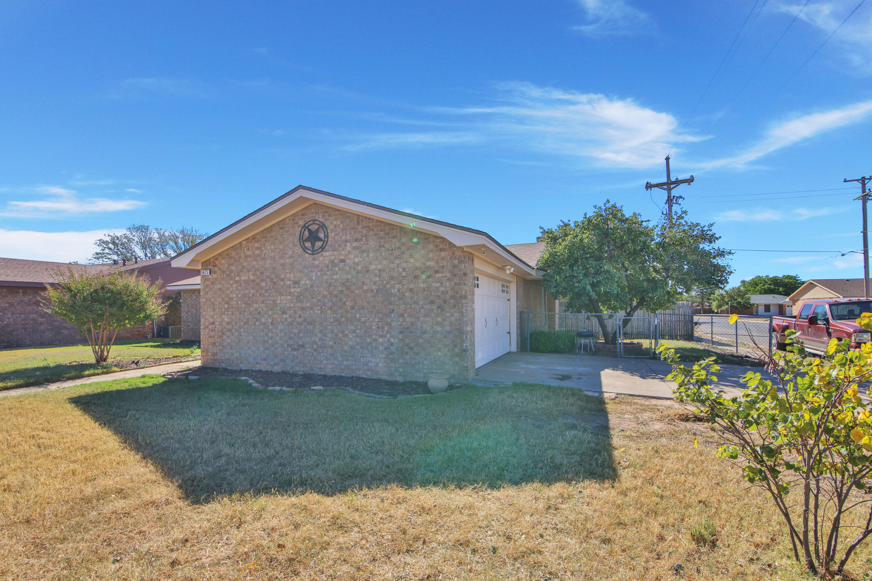 5625 Amherst Street Lubbock, TX 79416 - Photo 4 of 32 a view of a house with a yard