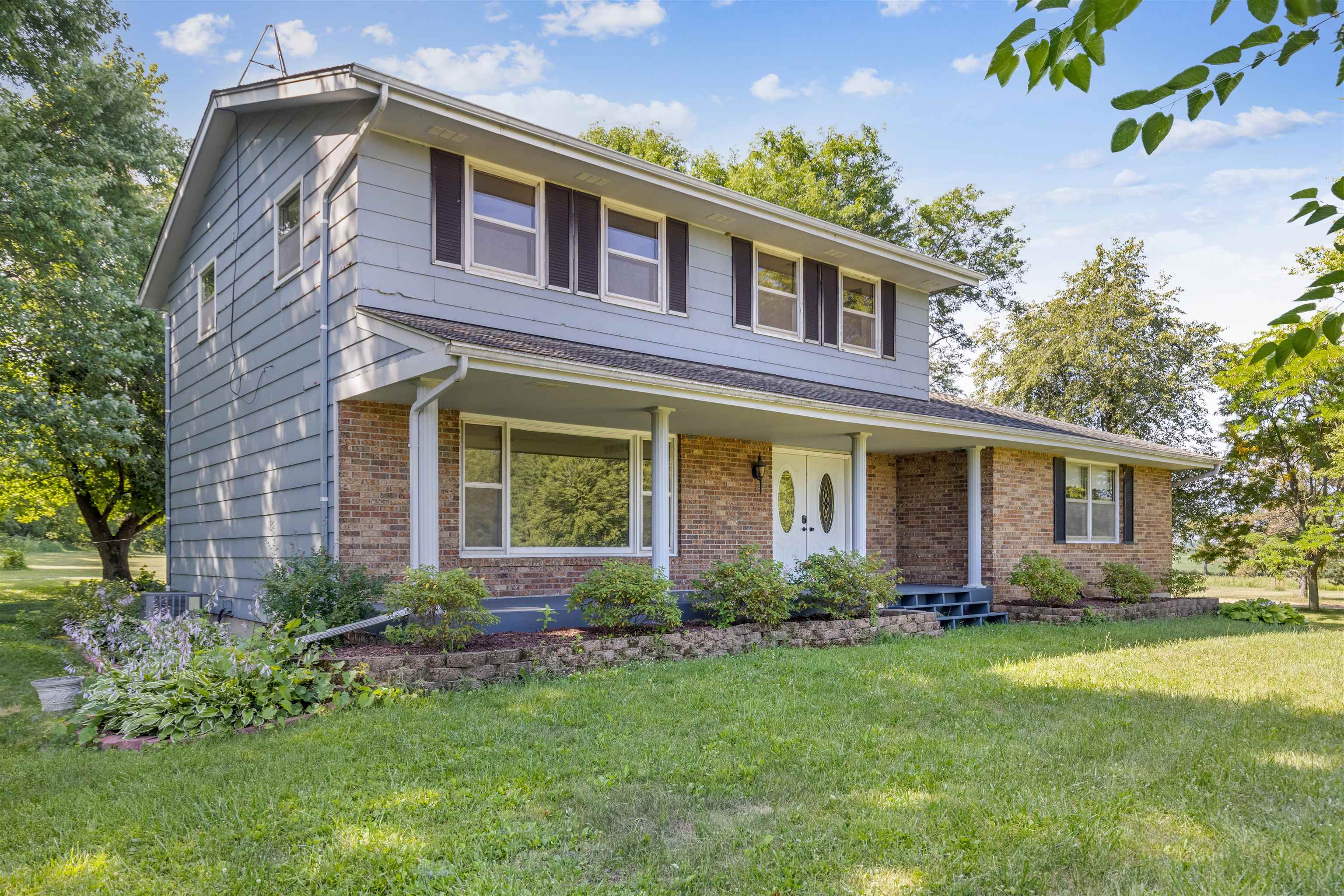 7660 Stephens Road Rockton, IL 61072 - Photo 1 of 34 a front view of house with yard and green space