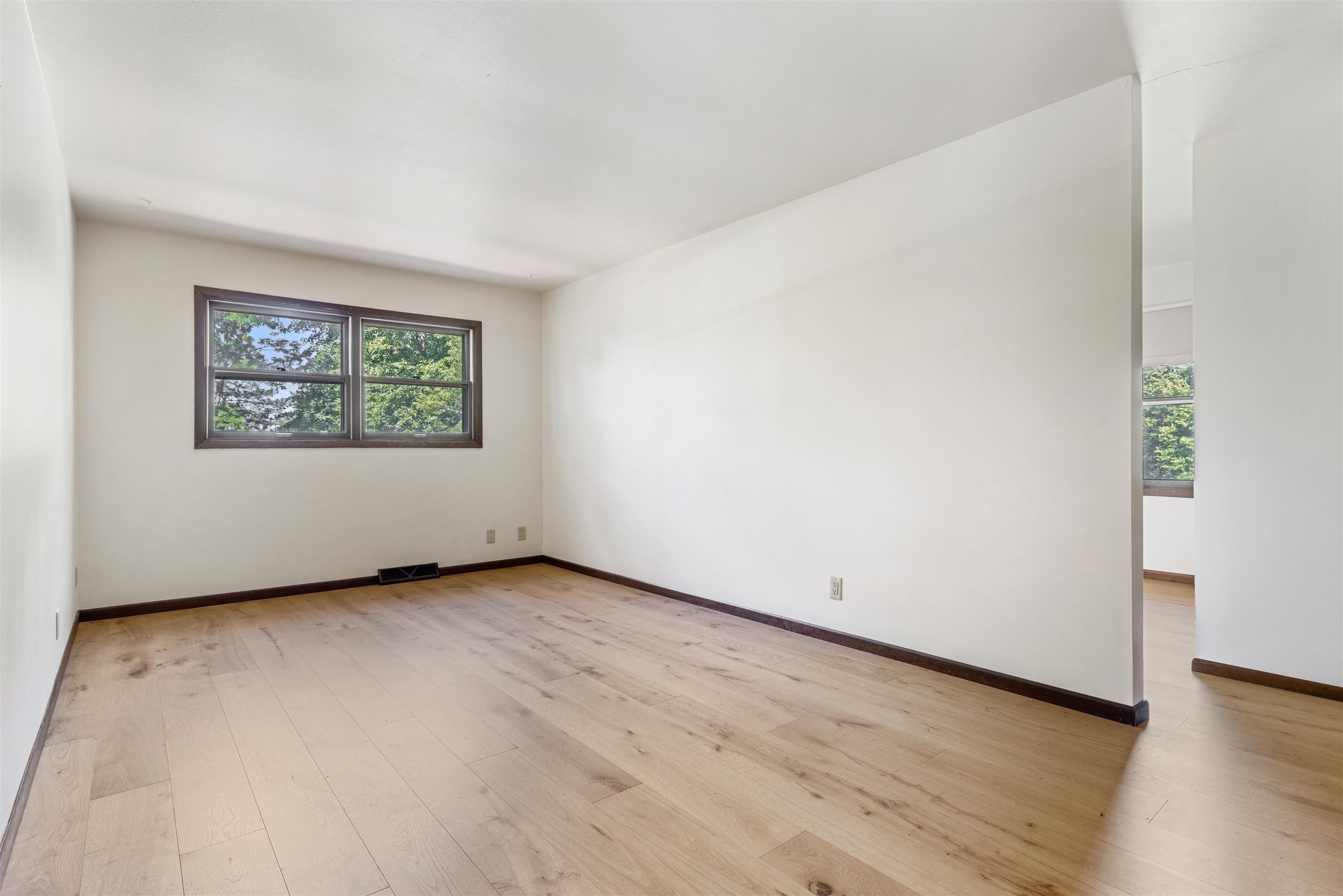 7660 Stephens Road Rockton, IL 61072 - Photo 12 of 34 an empty room with wooden floor and window