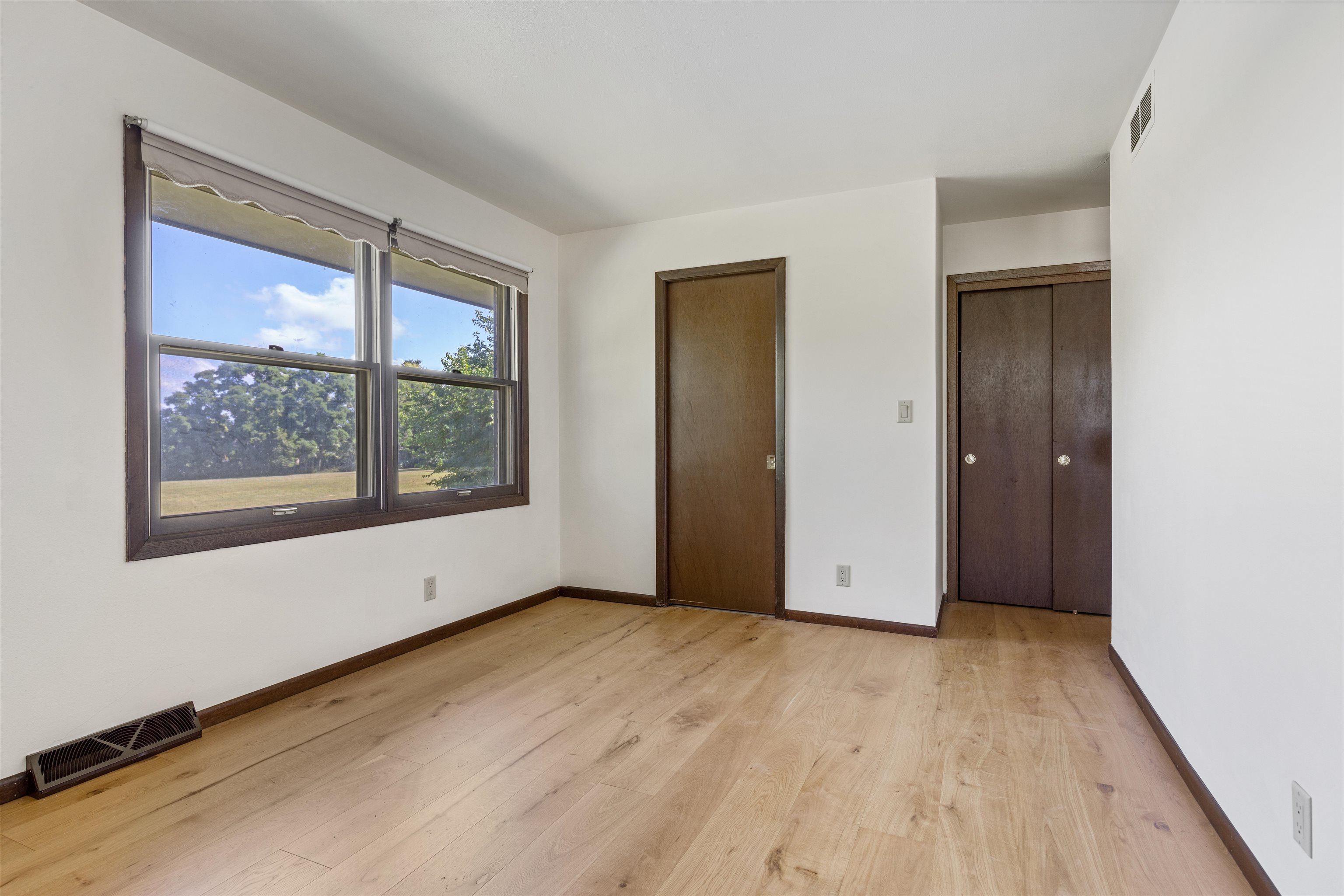 7660 Stephens Road Rockton, IL 61072 - Photo 14 of 34 an empty room with wooden floor and windows