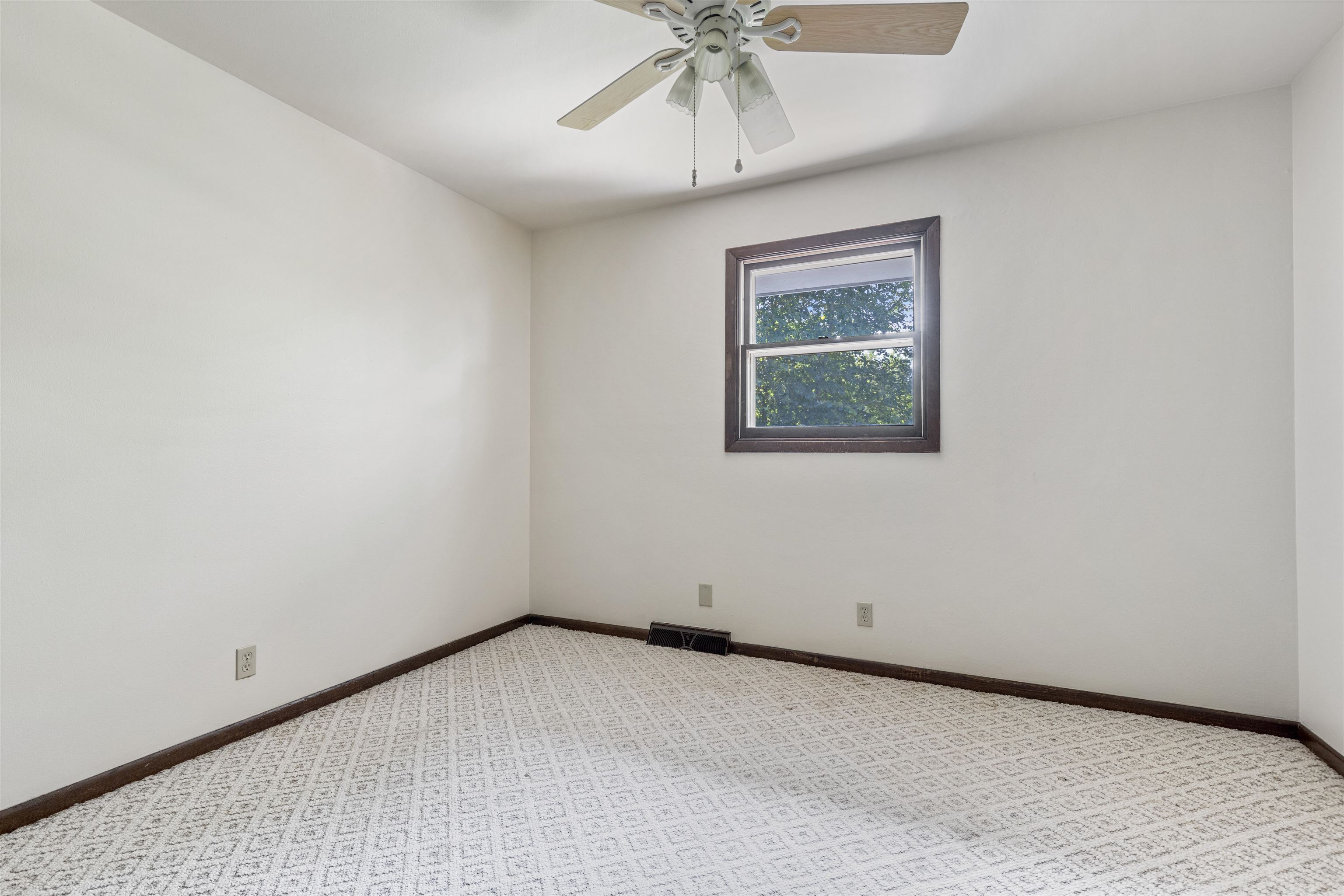7660 Stephens Road Rockton, IL 61072 - Photo 17 of 34 an empty room with a window and a ceiling fan