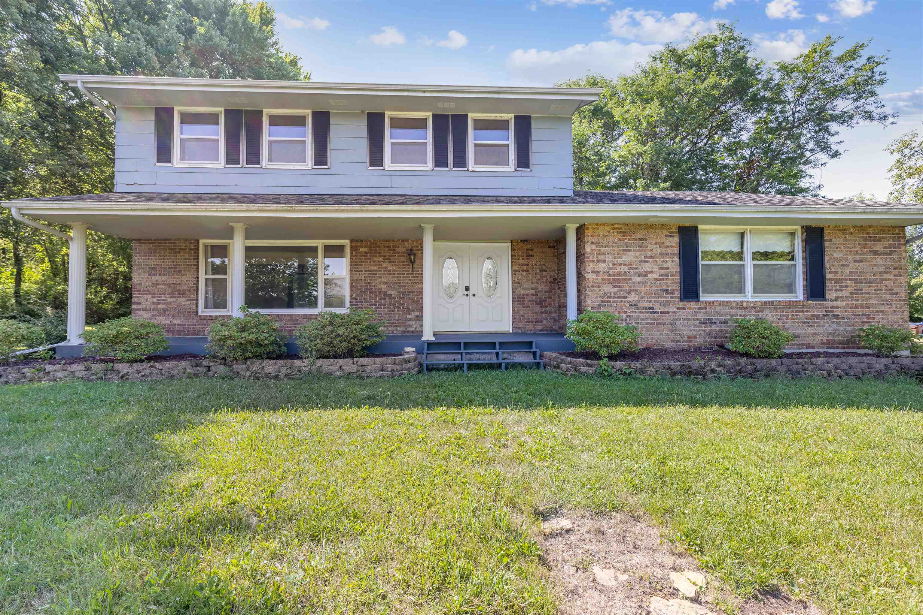 7660 Stephens Road Rockton, IL 61072 - Photo 2 of 34 a front view of a house with garden