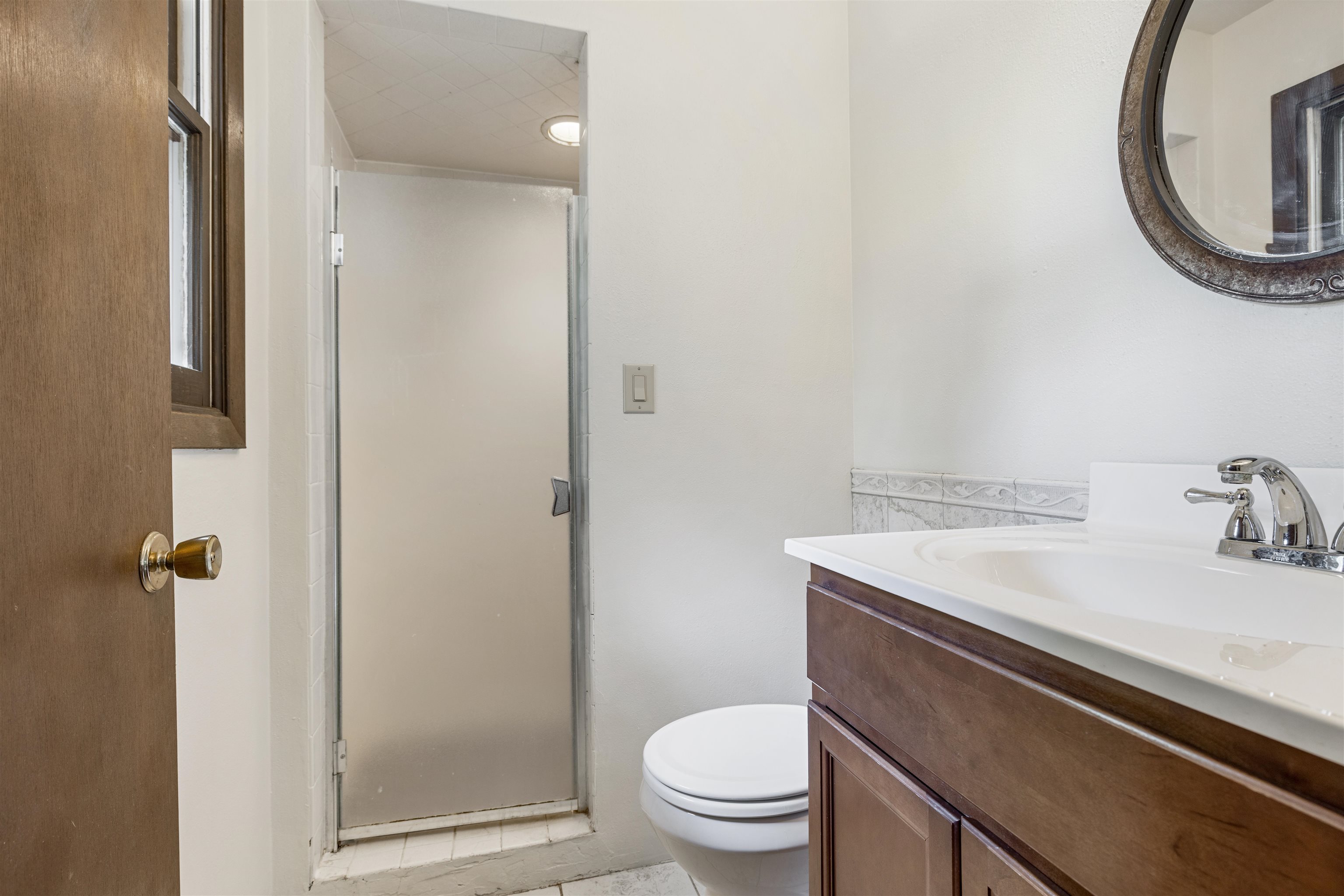 7660 Stephens Road Rockton, IL 61072 - Photo 26 of 34 a bathroom with a sink a toilet and a mirror